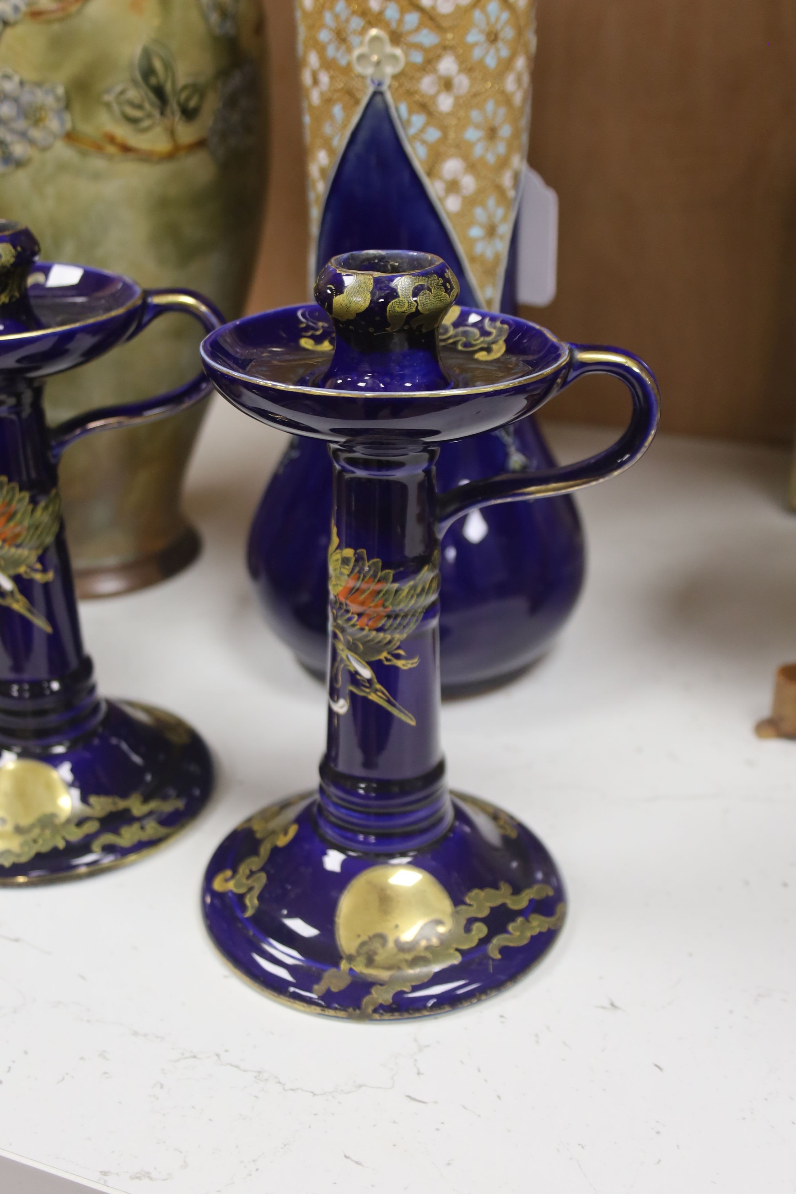 A pair of Frederick Rhead for H. H. & G. Ltd of 'Golden Moon' design candlesticks